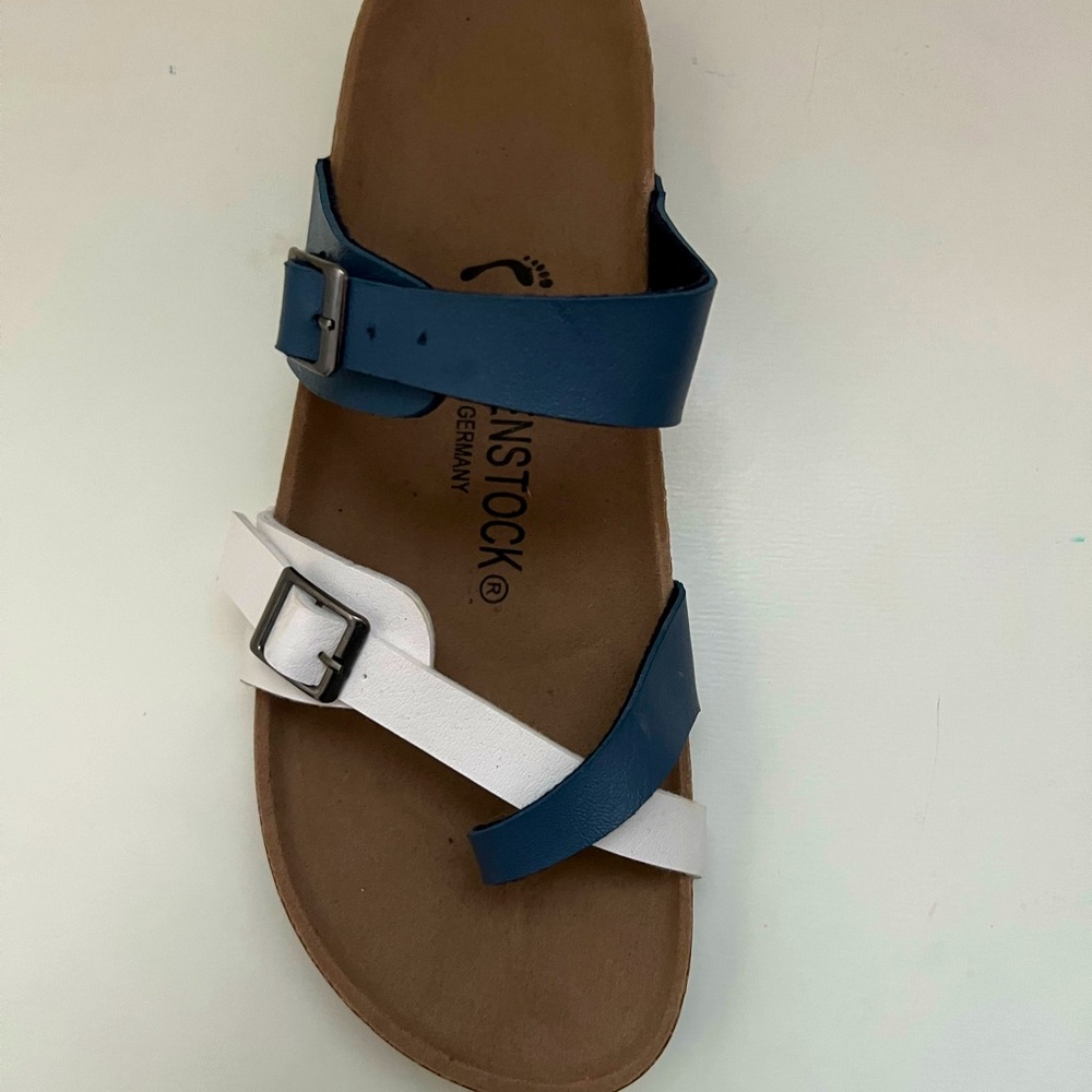blue and white strapped birkenstocks. size 7.5. brand new